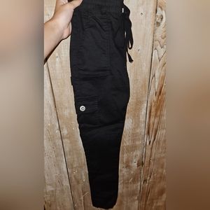 All black cargo pants with pockets on both side
